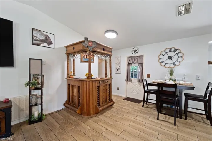 Dining area featuring wood finish floors and baseboards