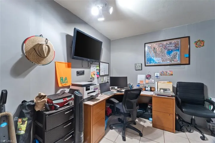 Office area with light tile patterned flooring
