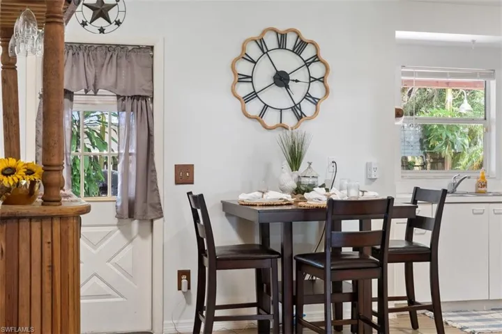Dining area with baseboards and light wood finished floors