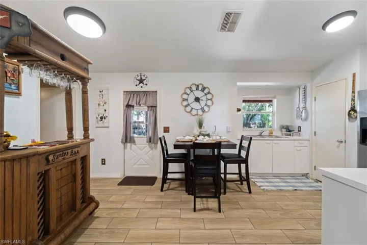 Dining area with plenty of natural light and wood tiled floors