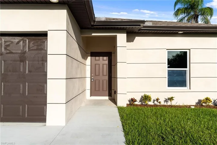 Property entrance with a garage