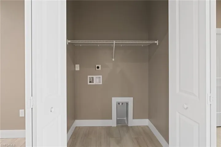 Laundry area with electric dryer hookup and washer hookup