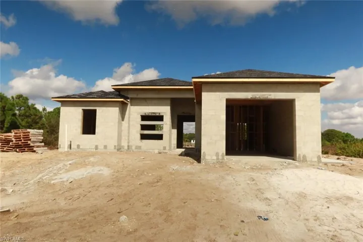 Back of property with a patio area