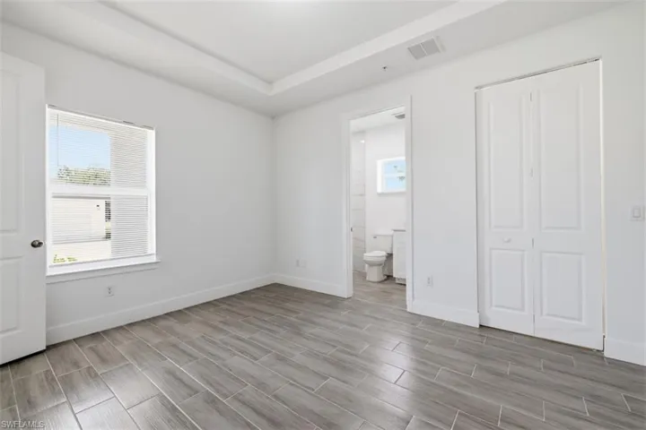 Primary Bedroom with tray ceilings + bathroom