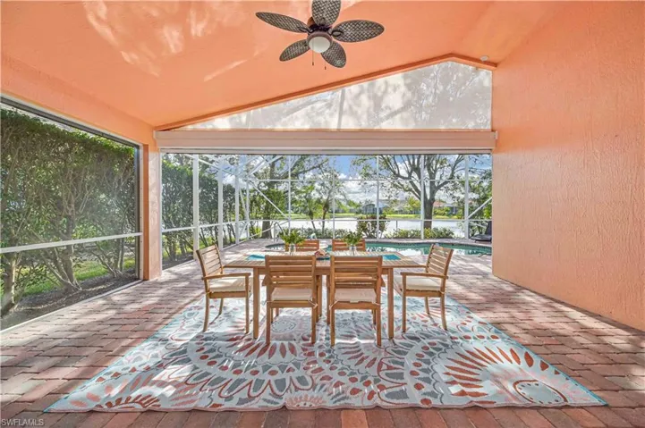 Sunroom featuring ceiling fan and lofted ceiling