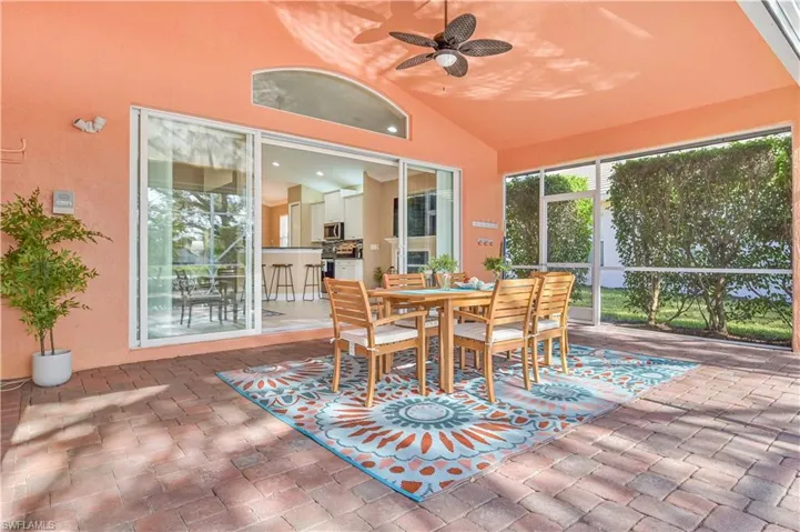 Sunroom / solarium with vaulted ceiling and ceiling fan