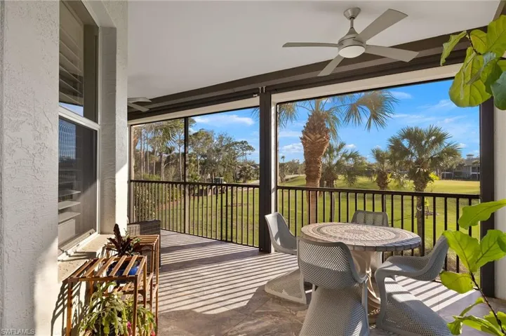 Expansive wrap around lanai with sweeping golf course views and ceramic tile flooring.