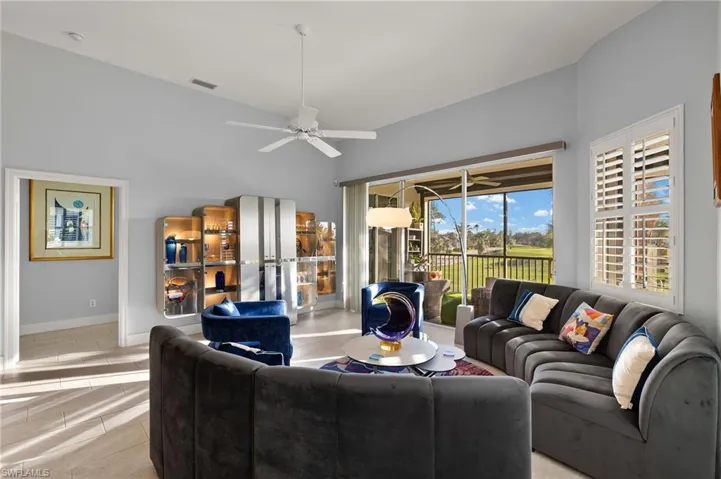 The living area features ceramic tile floors and plantation shutters.