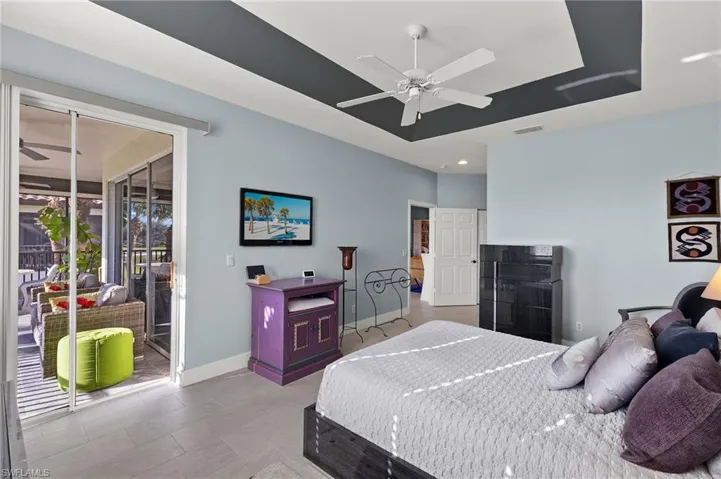 Primary bedroom with lanai access.