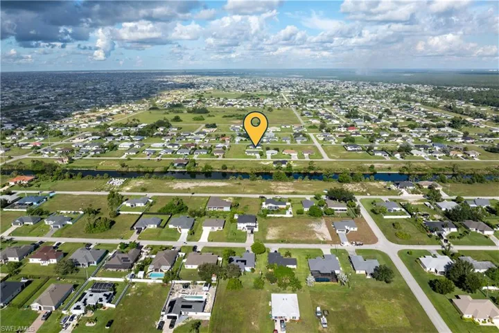 View of property location with a nearby body of water and nearby suburban area