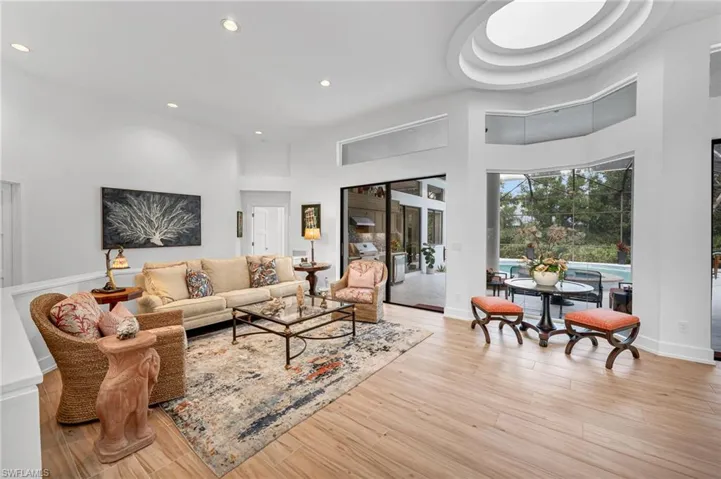 Sliders for easy access to outdoor grill area, covered lanai, and pool/spa.