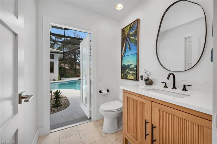 Pool bathroom is right off the pool area. No wet feet running through the house. Also, a storage closet was added for the towels!