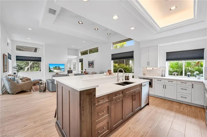 Kitchen to Family room.  Coffered ceilings with LED lighting.  New cabinetry offers wonderful storage options.