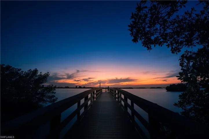 Estero Bay Park pier with sunset water vistas