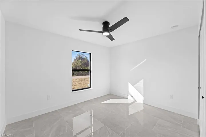 Spare room featuring ceiling fan