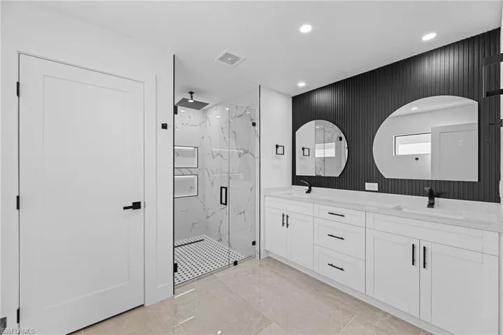 Bathroom featuring vanity and walk in shower