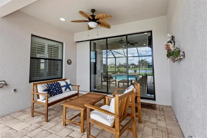View of patio featuring outdoor lounge area, a lanai, and ceiling fan