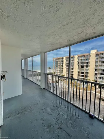 Unfurnished sunroom featuring a water view
