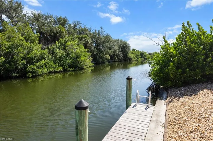 Dock featuring a water view