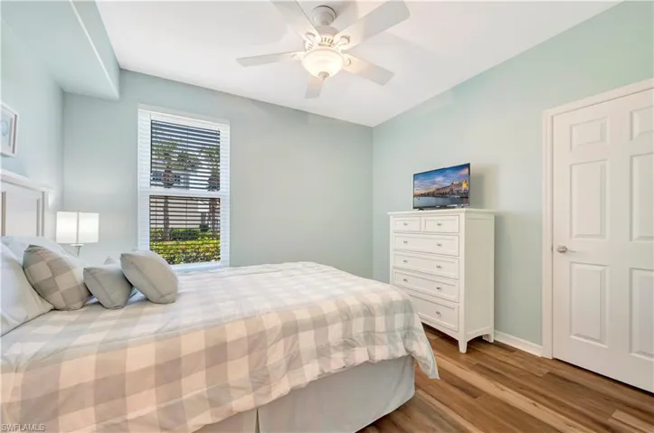 Bedroom with light wood-type flooring and a ceiling fan