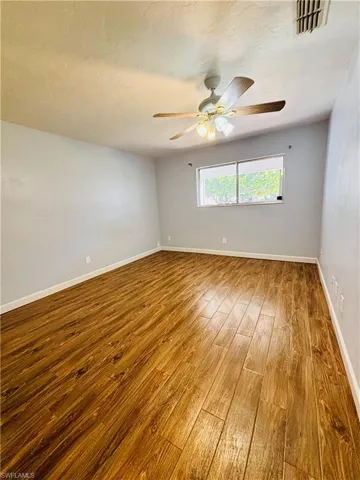 Unfurnished room featuring baseboards and light wood-style floors