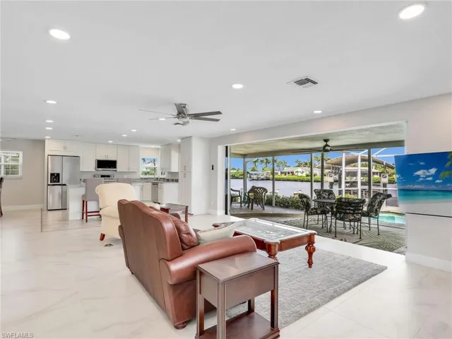 Living room with the breath taking view of the water through the sliders
