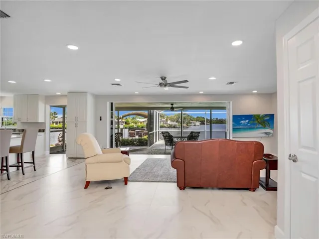 Living room with the breath taking view of the water through the sliders
