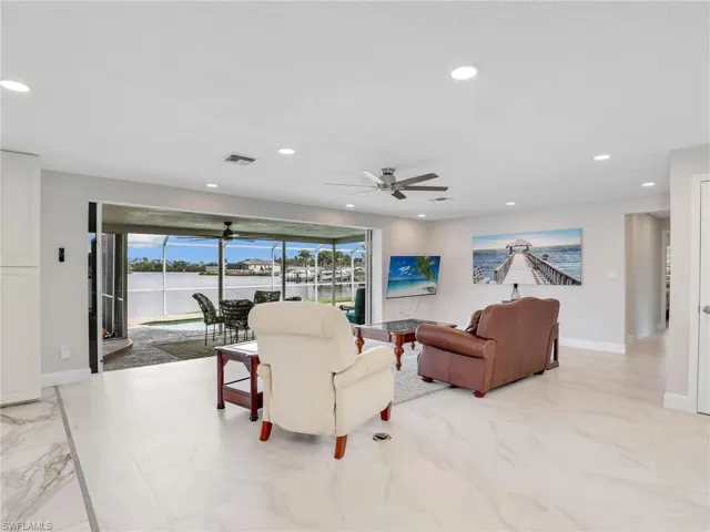 Living room with the breath taking view of the water through the sliders