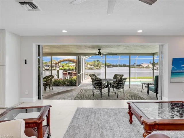 Living room with the breath taking view of the water through the sliders