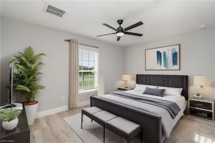Bedroom with light wood-type flooring and ceiling fan
