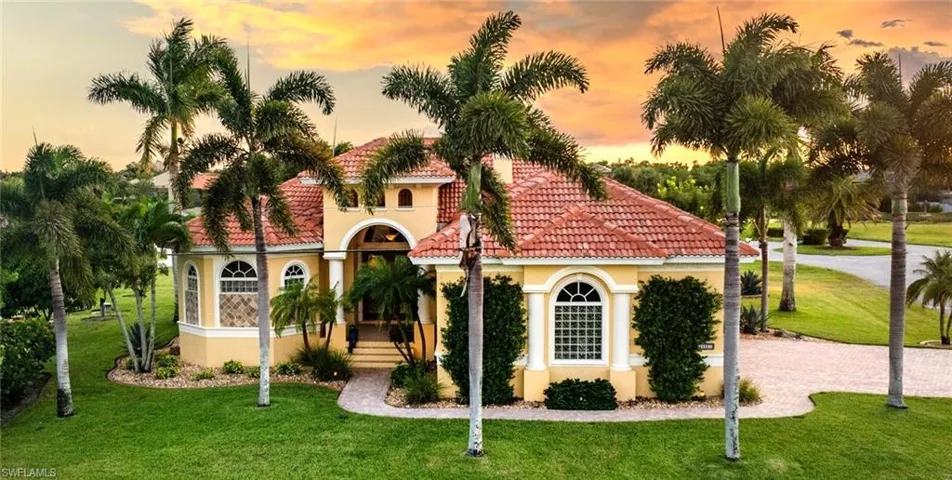 Mediterranean / spanish home featuring a yard