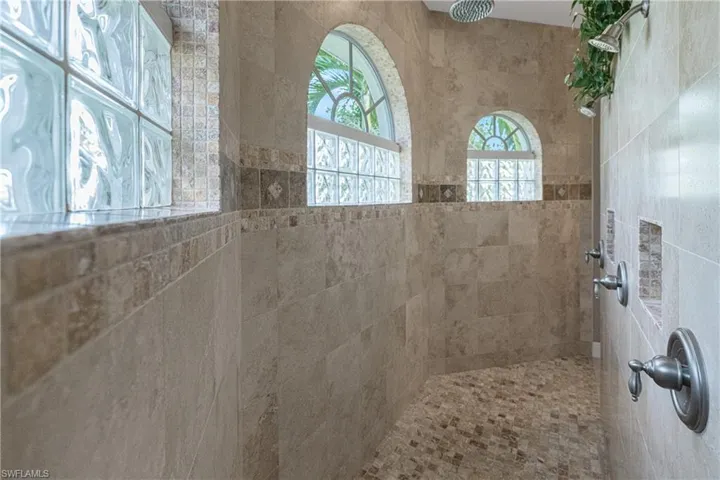 Bathroom featuring tiled shower