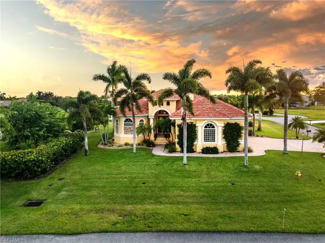 Mediterranean / spanish-style home featuring a lawn