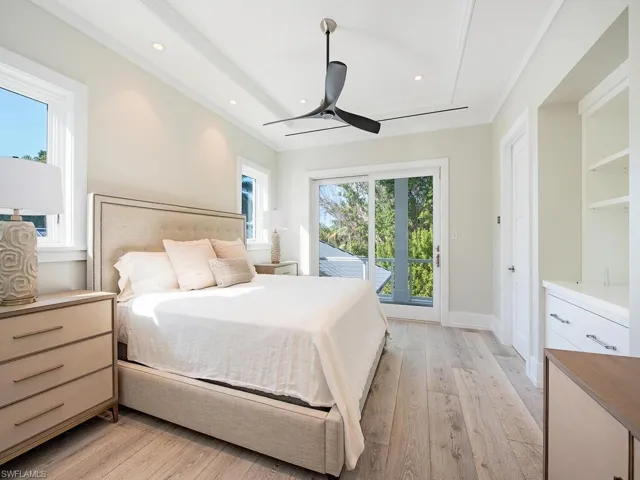 Bedroom featuring light wood-type flooring, ceiling fan, multiple windows, access to outside, and recessed lighting