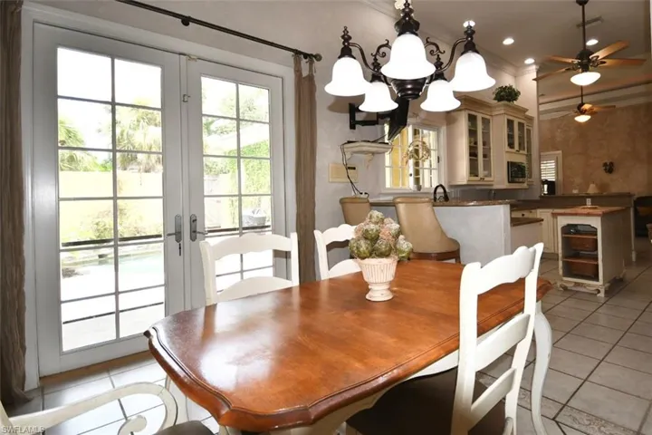 Breakfast room with French doors & view of courtyard looking into kitchen