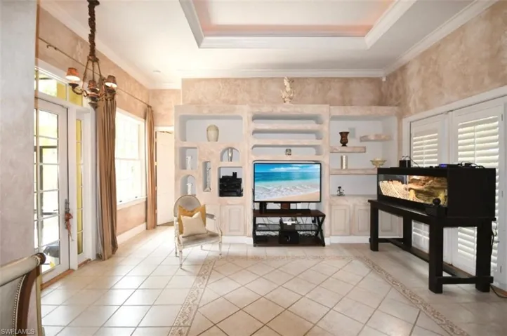Living area and foyer with chandelier