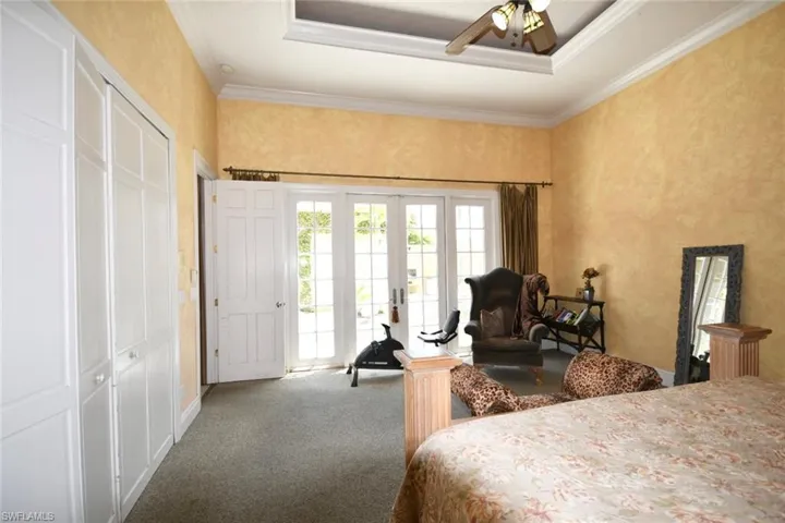 Main bedroom featuring French doors with courtyard view
