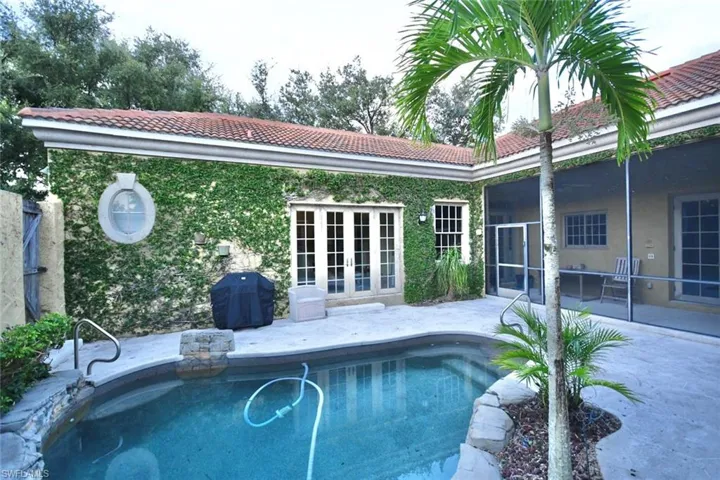 View of courtyard, pool & screened lanai