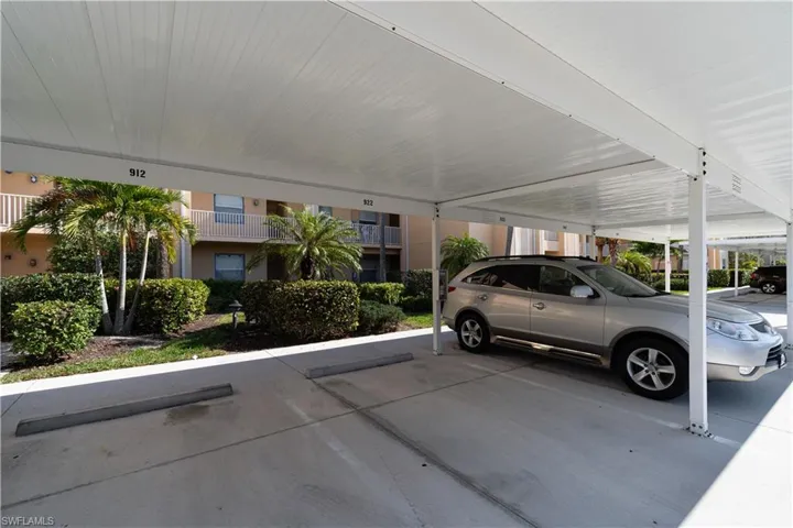 View of parking with a carport