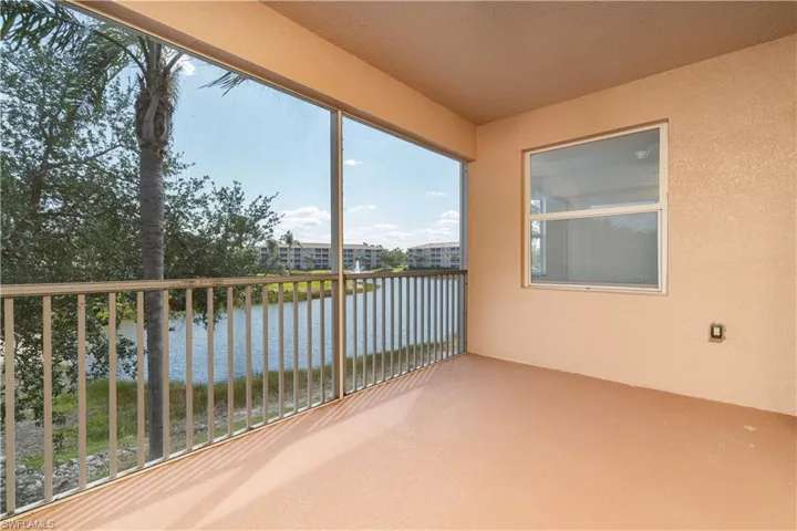 Unfurnished sunroom with a water view