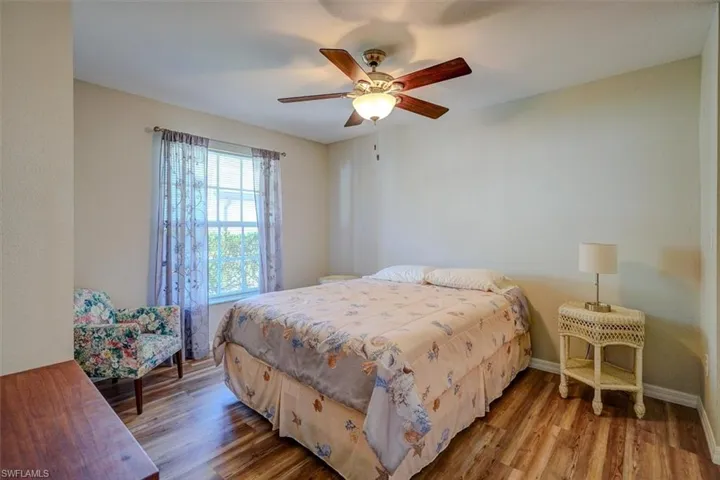 Bedroom featuring wood finished floors and a ceiling fan