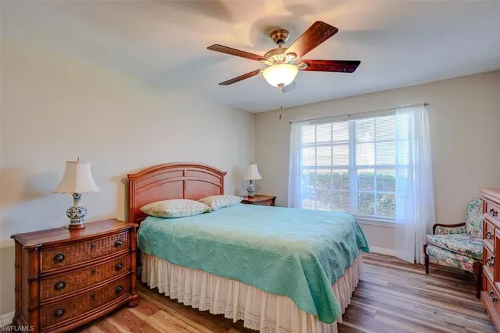 Bedroom featuring light wood-style flooring and a ceiling fan