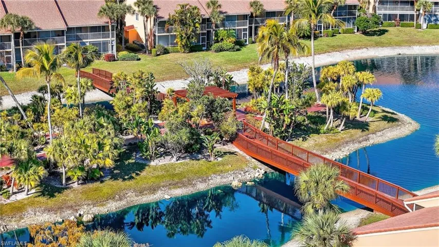 Aerial view of a large body of water and apartment complex / building