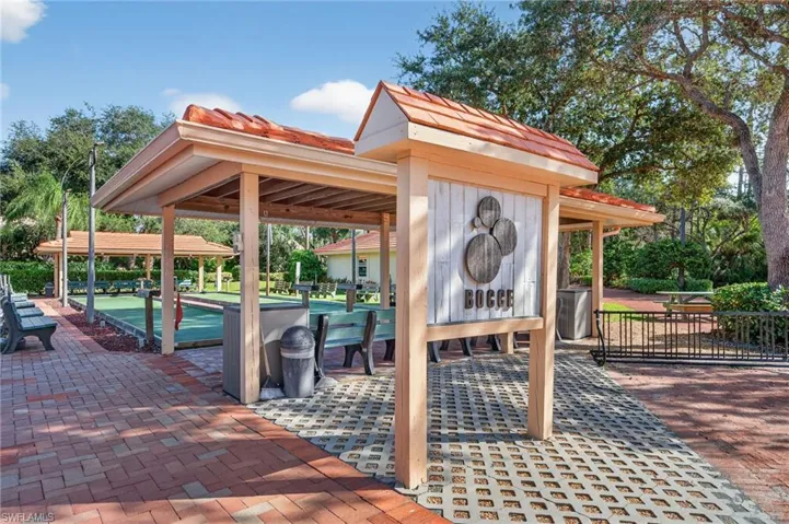 View of home's community featuring a patio area and a bocce ball area