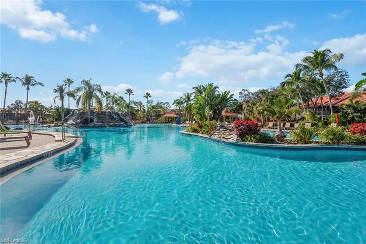 Community pool with a patio