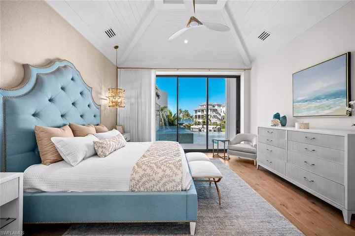 Bedroom with light wood-style flooring, access to outside, vaulted ceiling, wooden ceiling, and a ceiling fan