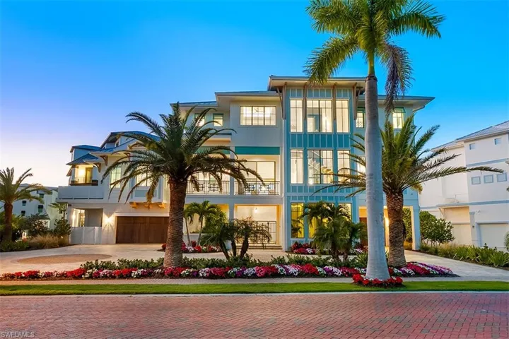 View of front of property featuring decorative driveway