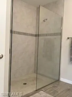 Bathroom featuring a shower with shower door