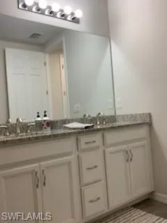 Bathroom featuring double sink vanity