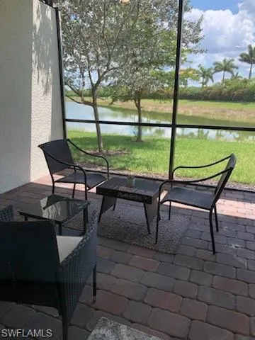 Sunroom / solarium with a water view